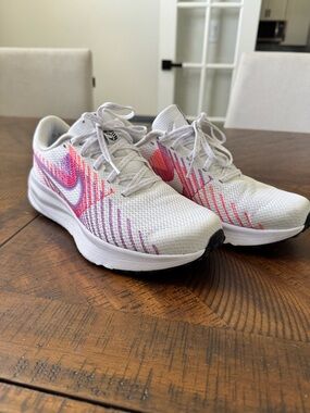 Nike Defy Women’s White Running Sneakers with Pink and Purple Accents
